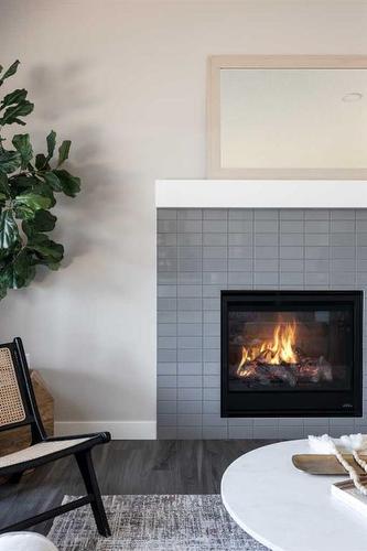 1 Hamptons Gate Se, Medicine Hat, AB - Indoor Photo Showing Living Room With Fireplace