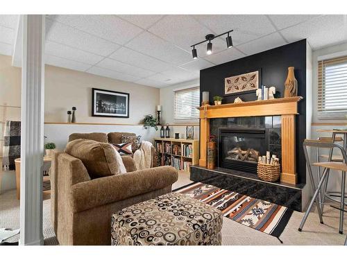 83 Stevenson Street Se, Medicine Hat, AB - Indoor Photo Showing Living Room With Fireplace