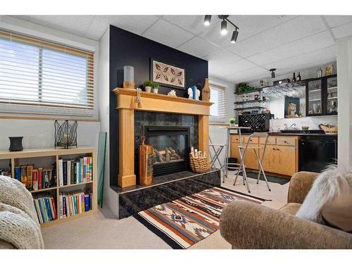 83 Stevenson Street Se, Medicine Hat, AB - Indoor Photo Showing Living Room With Fireplace