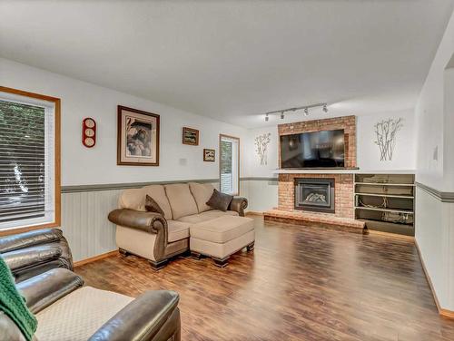 155 Shannon Drive Se, Medicine Hat, AB - Indoor Photo Showing Living Room With Fireplace