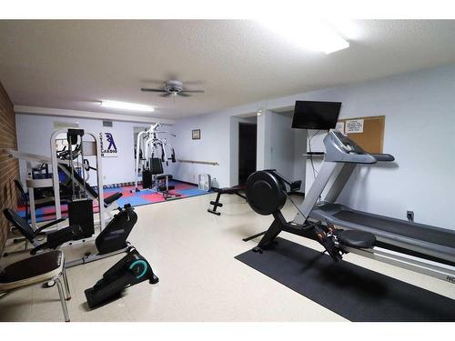 225-3090 15 Avenue Se, Medicine Hat, AB - Indoor Photo Showing Gym Room