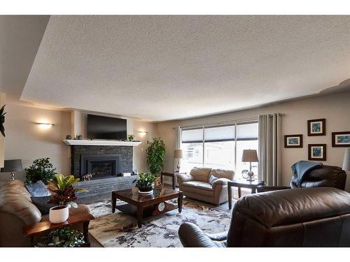 2298 Higdon Avenue Se, Medicine Hat, AB - Indoor Photo Showing Living Room With Fireplace