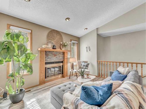 5 Ross View Bay Se, Medicine Hat, AB - Indoor Photo Showing Living Room With Fireplace