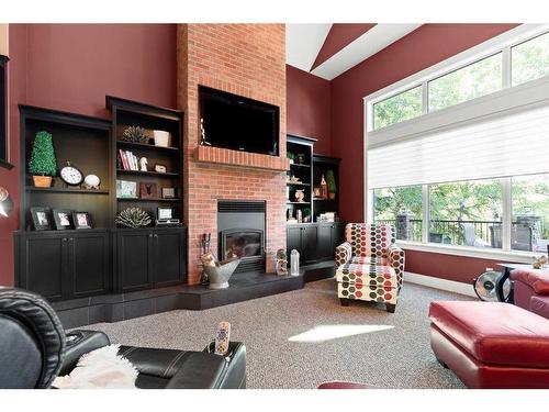 210 6 Avenue, Rural Cypress County, AB - Indoor Photo Showing Living Room With Fireplace