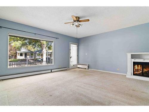 269 7 Street Se, Medicine Hat, AB - Indoor Photo Showing Other Room With Fireplace