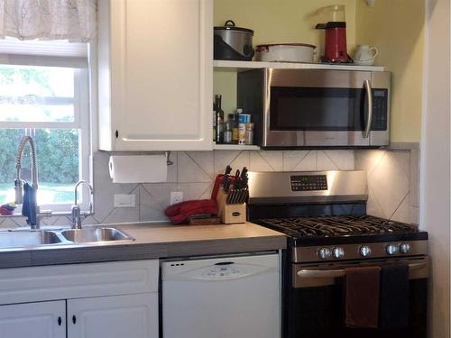 2 1 Street West, Schuler, AB - Indoor Photo Showing Kitchen With Double Sink