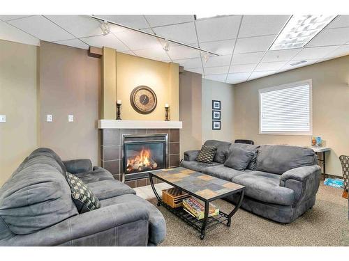 113-194 Sunrise Circle Sw, Medicine Hat, AB - Indoor Photo Showing Other Room With Fireplace