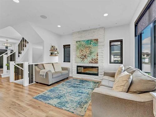 196 Hamptons Crescent Se, Medicine Hat, AB - Indoor Photo Showing Living Room With Fireplace