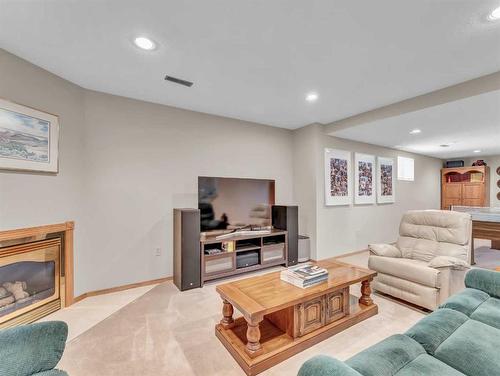 83 Taylor Boulevard Se, Medicine Hat, AB - Indoor Photo Showing Living Room With Fireplace