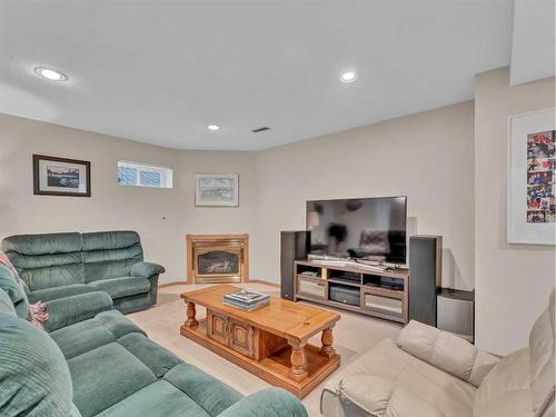 83 Taylor Boulevard Se, Medicine Hat, AB - Indoor Photo Showing Living Room With Fireplace