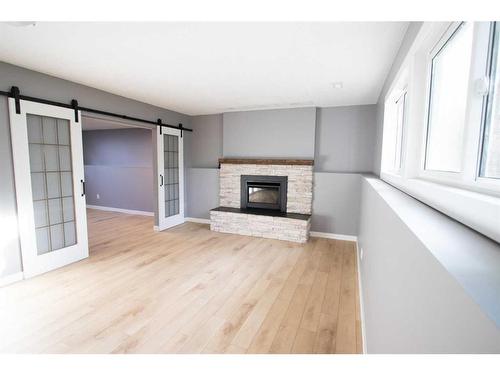 1765 9 Avenue Ne, Medicine Hat, AB - Indoor Photo Showing Living Room With Fireplace