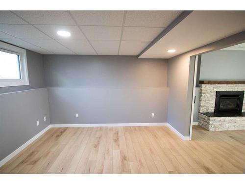 1765 9 Avenue Ne, Medicine Hat, AB - Indoor Photo Showing Other Room With Fireplace