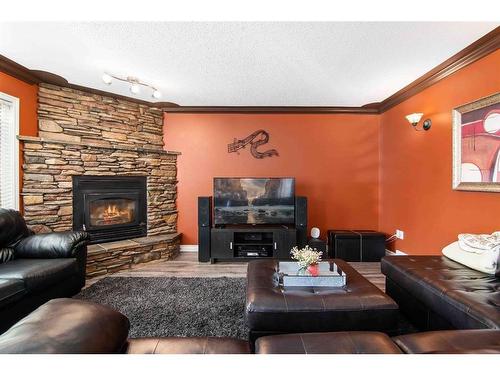 111 Sunrise Circle Sw, Medicine Hat, AB - Indoor Photo Showing Living Room With Fireplace