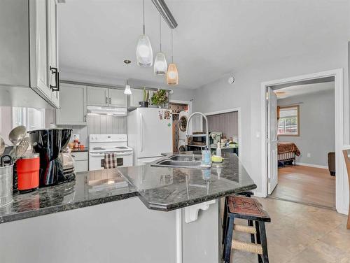 12309 Day Street, Rural Cypress County, AB - Indoor Photo Showing Kitchen With Double Sink