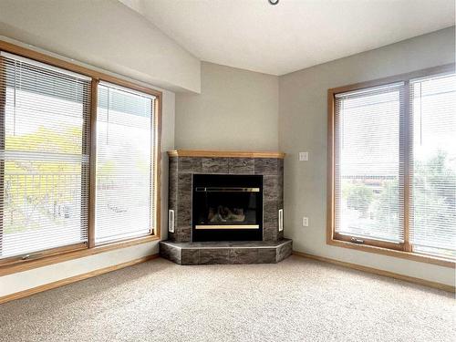 5-359 4 Street Se, Medicine Hat, AB - Indoor Photo Showing Living Room With Fireplace