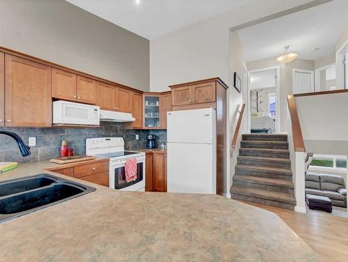 16 Terrace Road Ne, Medicine Hat, AB - Indoor Photo Showing Kitchen With Double Sink