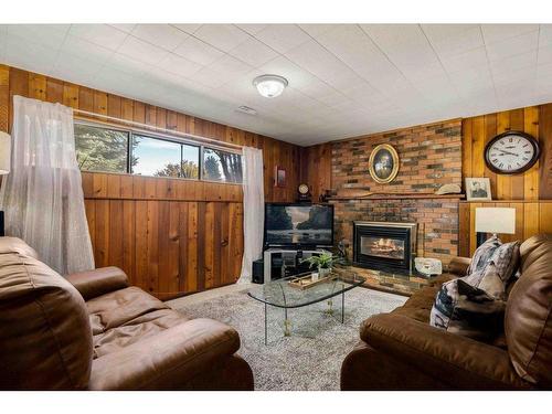 242 Carry Drive Se, Medicine Hat, AB - Indoor Photo Showing Living Room With Fireplace