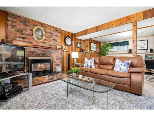 242 Carry Drive Se, Medicine Hat, AB - Indoor Photo Showing Living Room With Fireplace