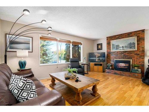 242 Carry Drive Se, Medicine Hat, AB - Indoor Photo Showing Living Room With Fireplace