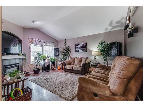 251 Hamptons Way Se, Medicine Hat, AB - Indoor Photo Showing Living Room With Fireplace