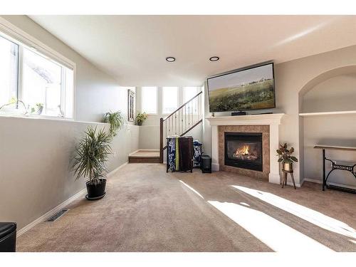 20 Cottonwood Close Sw, Medicine Hat, AB - Indoor Photo Showing Other Room With Fireplace