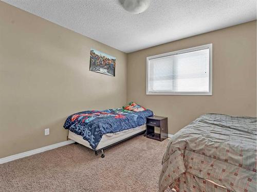 53 Hamptons Way Se, Medicine Hat, AB - Indoor Photo Showing Bedroom