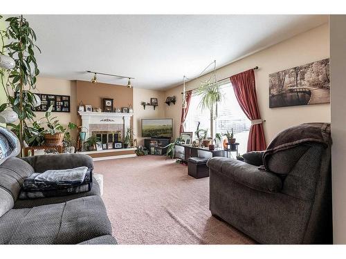 454 Hilton Crescent Ne, Medicine Hat, AB - Indoor Photo Showing Living Room With Fireplace