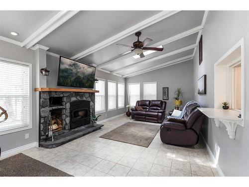 409 3 Street, Rural Cypress County, AB - Indoor Photo Showing Living Room With Fireplace