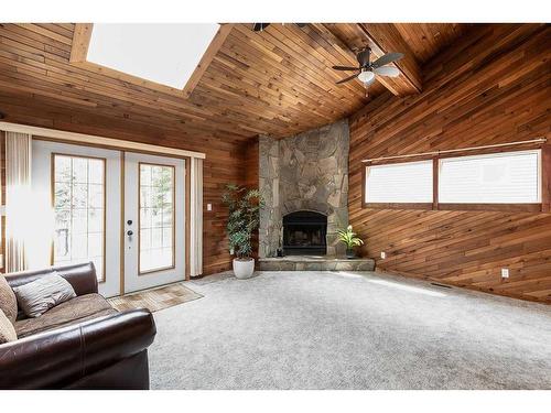 409 3 Street, Rural Cypress County, AB - Indoor Photo Showing Living Room With Fireplace