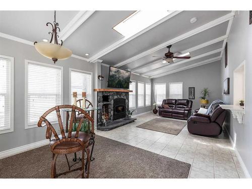 409 3 Street, Rural Cypress County, AB - Indoor Photo Showing Living Room With Fireplace