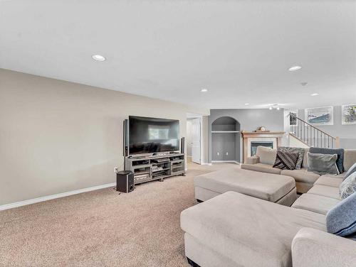 24 Cottonwood Close Sw, Medicine Hat, AB - Indoor Photo Showing Living Room With Fireplace