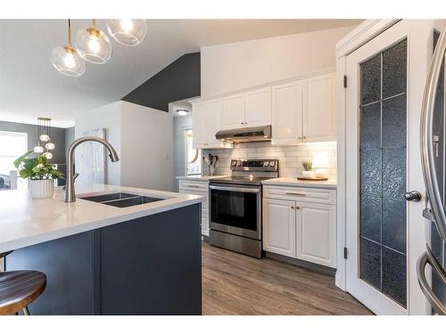 24 Terrace Place Ne, Medicine Hat, AB - Indoor Photo Showing Kitchen With Double Sink With Upgraded Kitchen