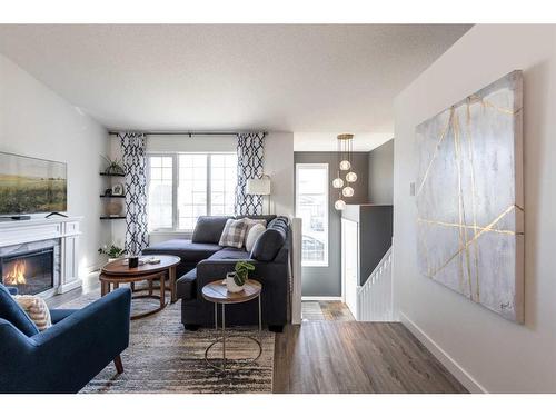 24 Terrace Place Ne, Medicine Hat, AB - Indoor Photo Showing Living Room With Fireplace