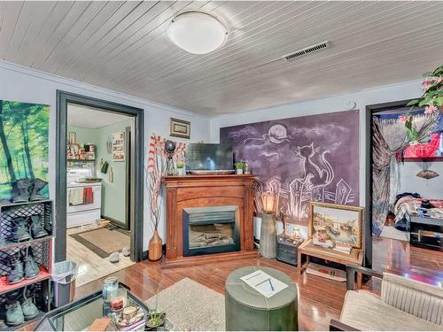 810B 5 Street Se, Medicine Hat, AB - Indoor Photo Showing Living Room With Fireplace