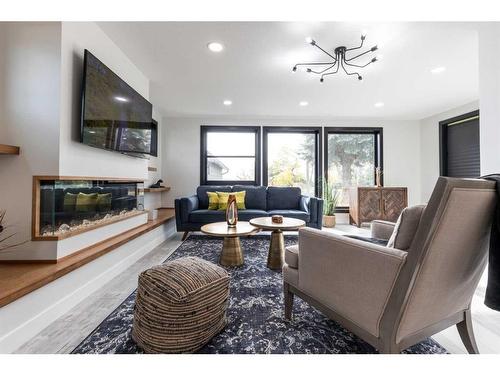 227 12 Street Se, Medicine Hat, AB - Indoor Photo Showing Living Room With Fireplace