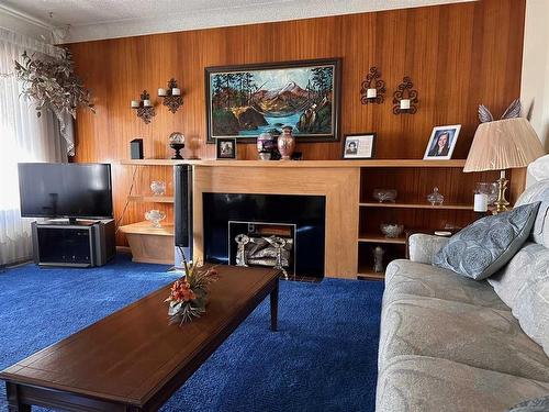 702 8Th Street Sw, Medicine Hat, AB - Indoor Photo Showing Living Room With Fireplace