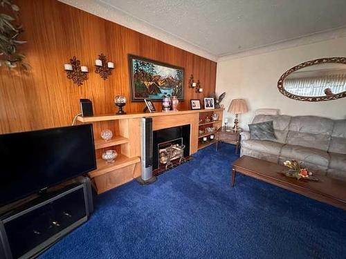 702 8Th Street Sw, Medicine Hat, AB - Indoor Photo Showing Living Room With Fireplace