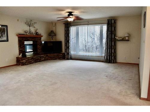 8501 Highway 570, Oyen, AB - Indoor Photo Showing Living Room With Fireplace