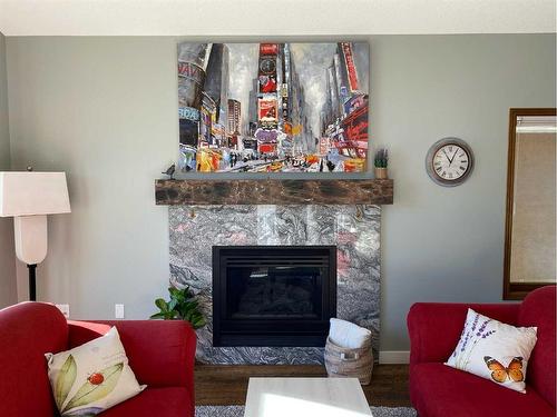 67 Vintage Meadows Place Se, Medicine Hat, AB - Indoor Photo Showing Living Room With Fireplace