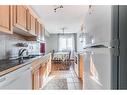 17-512 Mccutcheon Drive Nw, Medicine Hat, AB  - Indoor Photo Showing Kitchen With Double Sink 