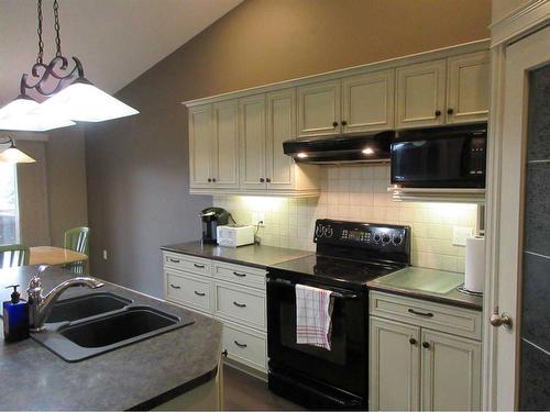 35 Sierra Lane Sw, Medicine Hat, AB - Indoor Photo Showing Kitchen With Double Sink