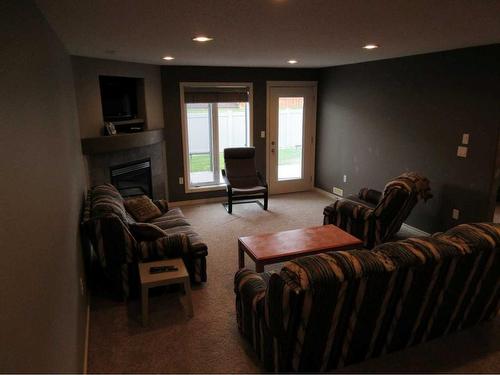 35 Sierra Lane Sw, Medicine Hat, AB - Indoor Photo Showing Living Room With Fireplace