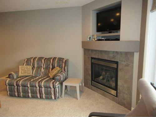 35 Sierra Lane Sw, Medicine Hat, AB - Indoor Photo Showing Living Room With Fireplace