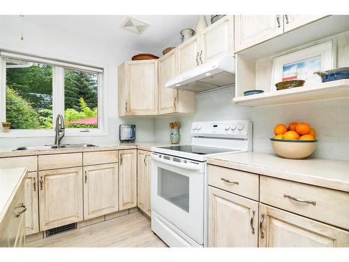 107 Sunset Road Sw, Medicine Hat, AB - Indoor Photo Showing Kitchen With Double Sink