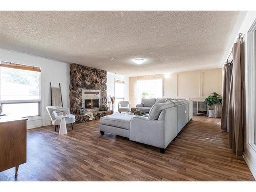 262 Mitchell Crescent Nw, Medicine Hat, AB - Indoor Photo Showing Living Room With Fireplace