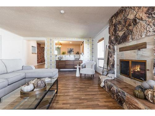 262 Mitchell Crescent Nw, Medicine Hat, AB - Indoor Photo Showing Living Room With Fireplace