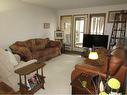 128-1480 Southview Drive Se, Medicine Hat, AB  - Indoor Photo Showing Living Room 