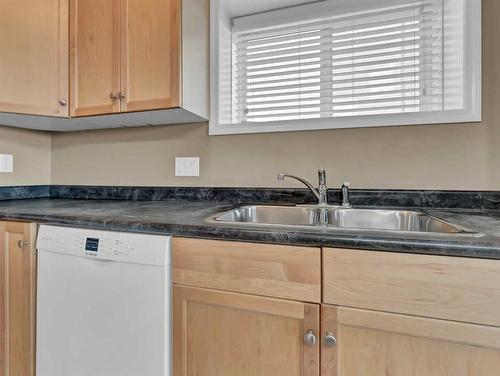 2-85 Sunrise Way Sw, Medicine Hat, AB - Indoor Photo Showing Kitchen With Double Sink