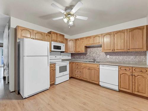 2021 Hawke Crescent Ne, Medicine Hat, AB - Indoor Photo Showing Kitchen With Double Sink