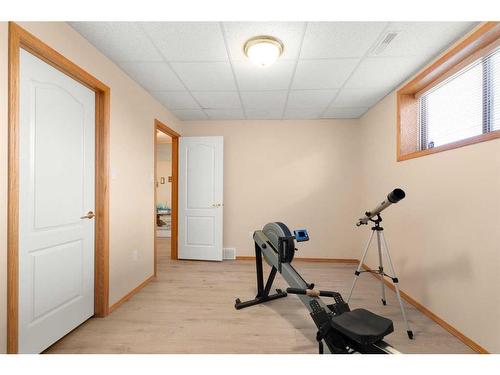 14 Riverview Drive Se, Redcliff, AB - Indoor Photo Showing Gym Room